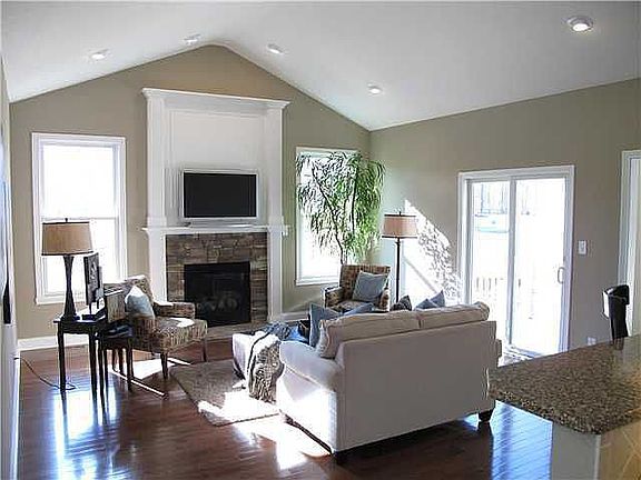 Cathedral Ceilings, Recessed Lighting, Stone FP, Sliding Doors to Patio.