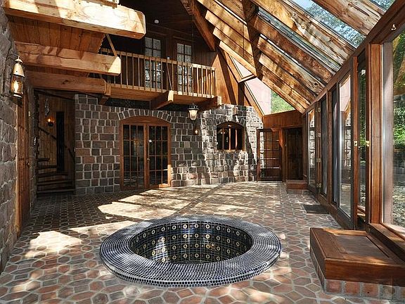Sun space collects heat, ducts