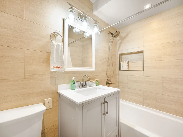 Another bathroom with same designs,bright and simple with a sleek floating vanity.