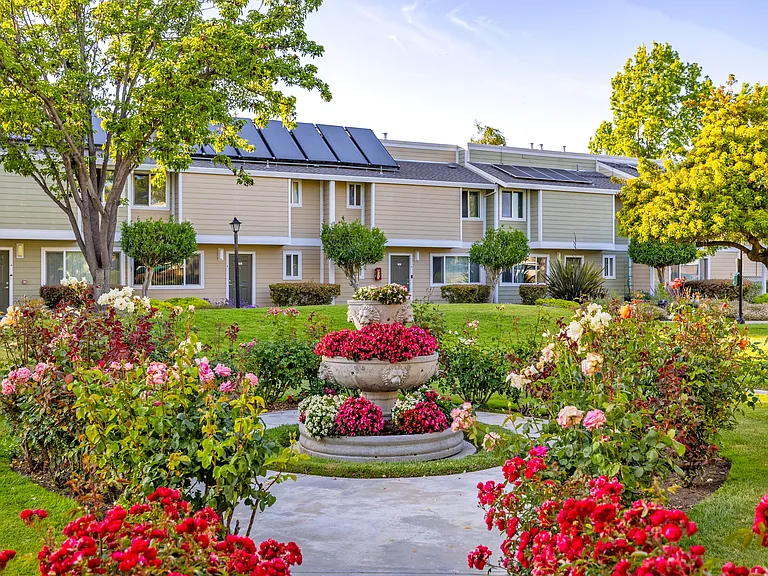 Peaceful garden courtyards filled with colorful blooms offer a serene retreat just steps from your front door.