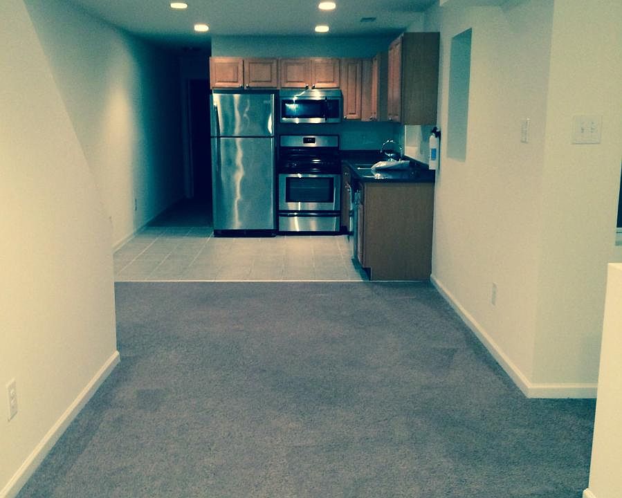 Standing in living room facing kitchen