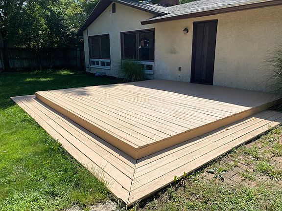 Deck at back of house, entrance through garage