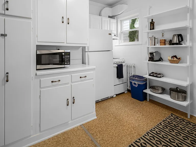 Kitchen which includes pots, pans, dishes etc.