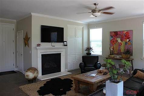 Built-in cabinetry to the right of gas-start fireplace