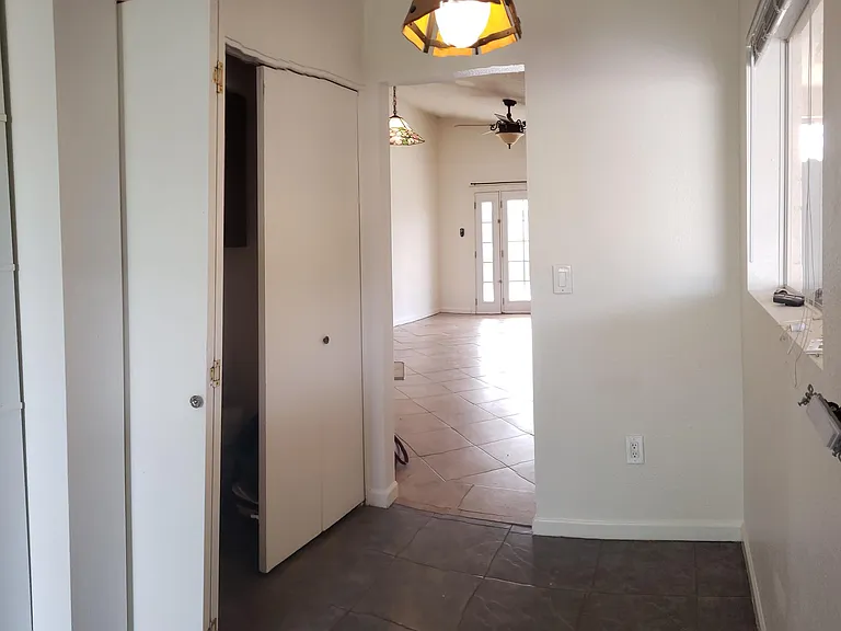 Kitchen with laundry closet and sitting area