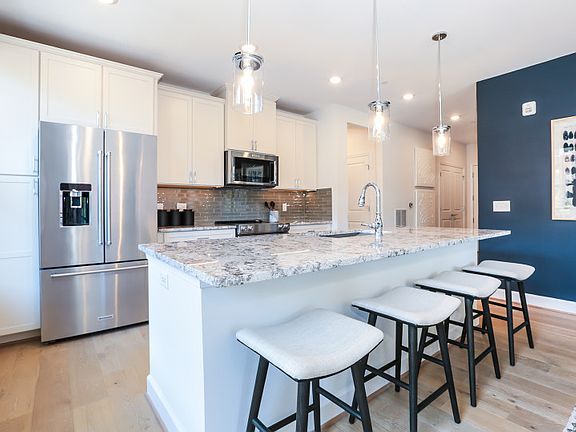 Model Representation - Chef s Dream Kitchen with KitchenAid Stainless Steel Appliances.