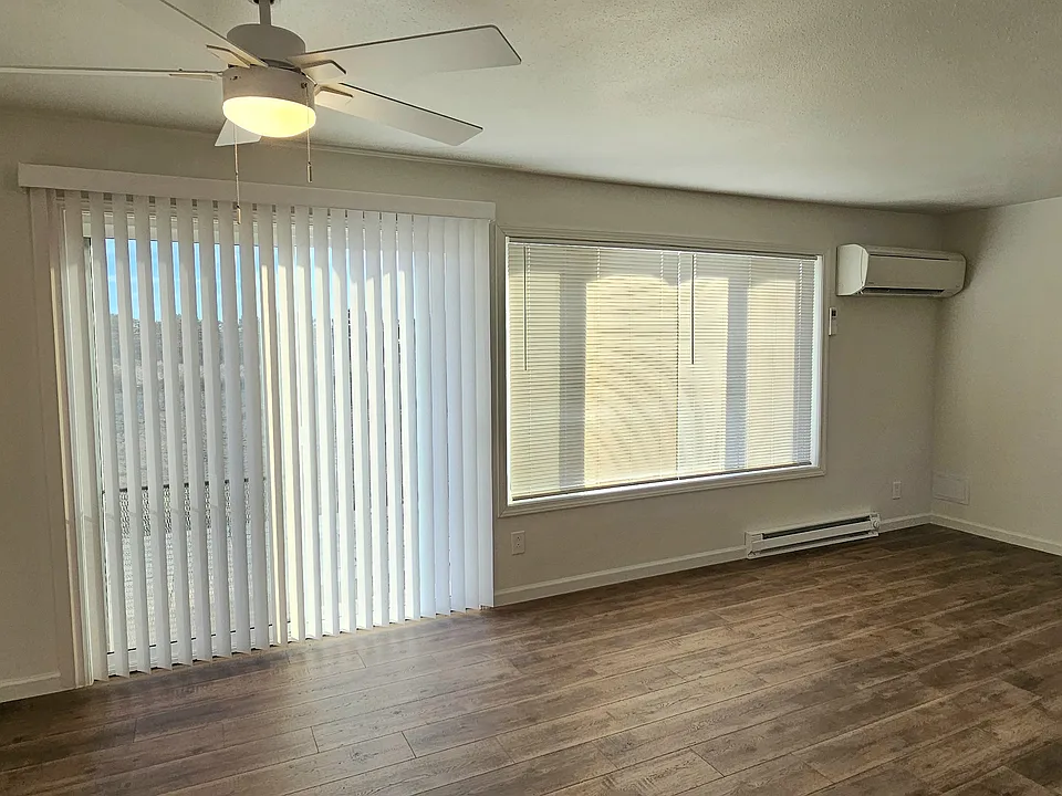 This space is part of the open floor plan of the living area. The picture window is grand while giving the space natural light enhancing that open feel. The slider goes to the patio in the fenced backyard Set up the grill for memorable backyard barbeques.