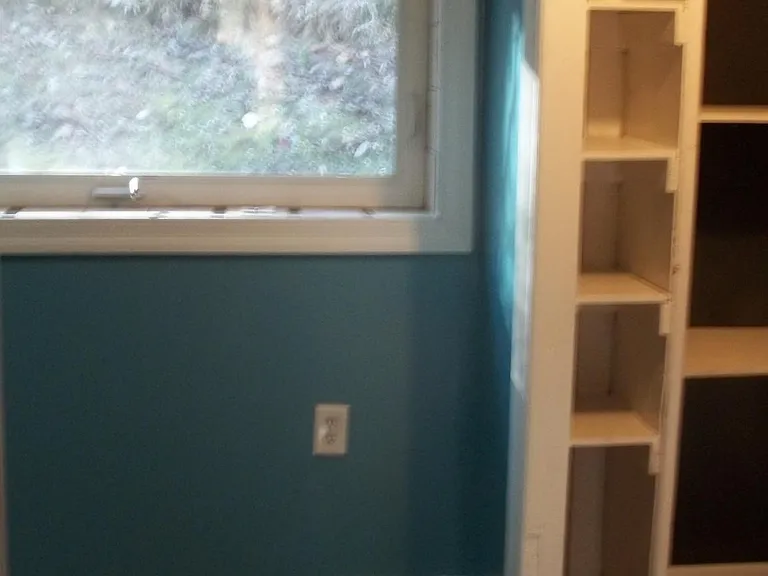 From bedroom doorway, can see window and into closet space