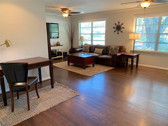 Lovely hardwood floors. Living room has the perfect spot for a work desk too.