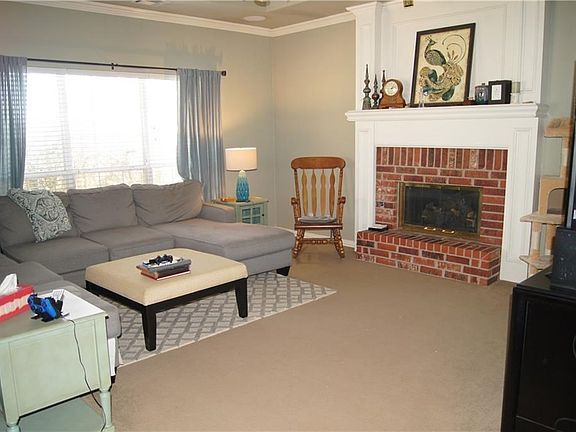 Huge family room off kitchen provides room for evenings by the fireplace.