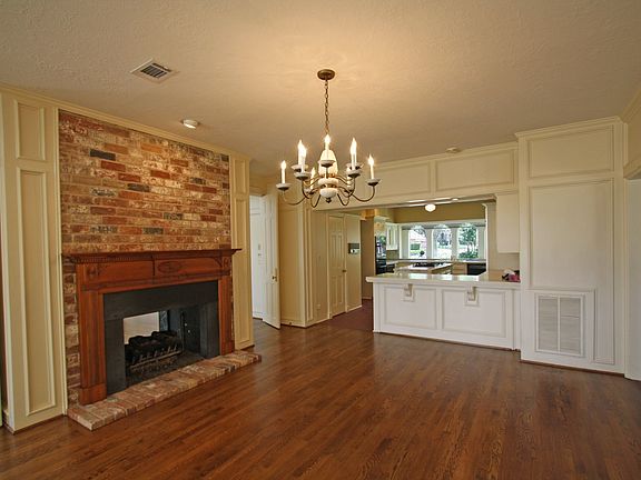 Kitchen is open to the breakfast area with a double sided fireplace