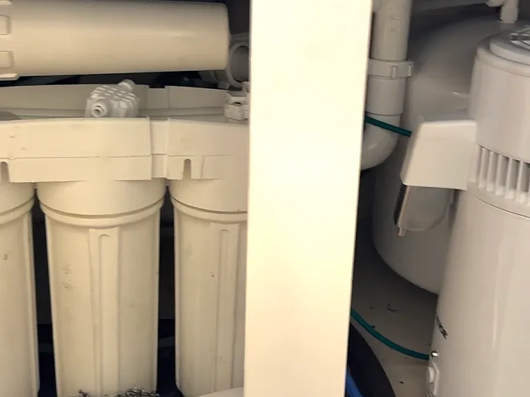 Reverse osmosis water filtration system under kitchen sink.