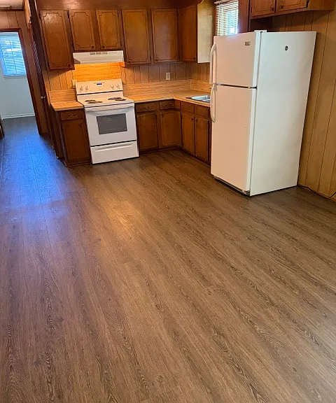 Kitchen has range & fridge - no dishwasher