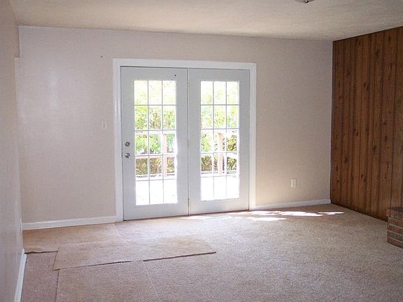 New carpet in the Great Room with French Doors leading outside to the deck!