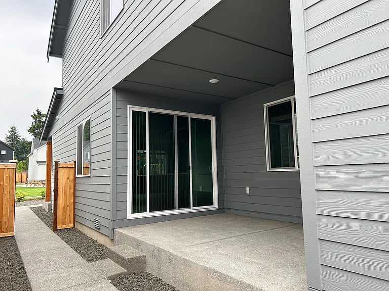 Covered Patio and Fenced Low maintainance side yard.