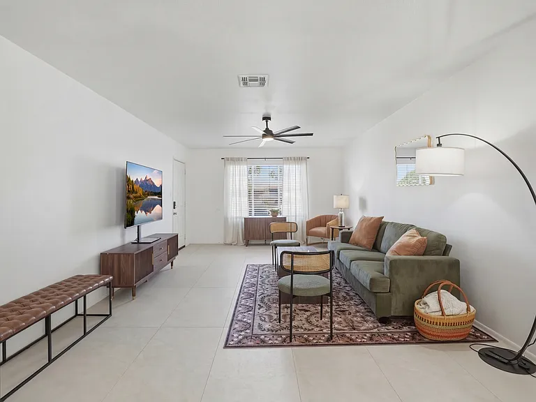 Living area with a large TV _ perfect for movie night.