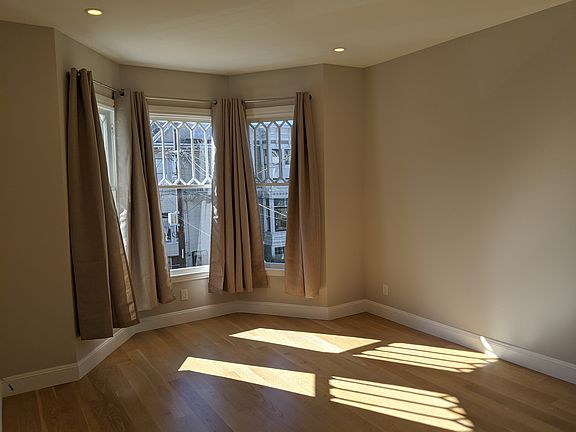 large sun-filled bedroom at the front of the unit