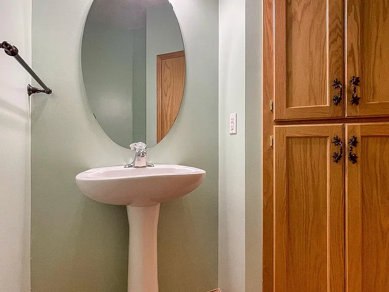 Main half bath with built-in closet