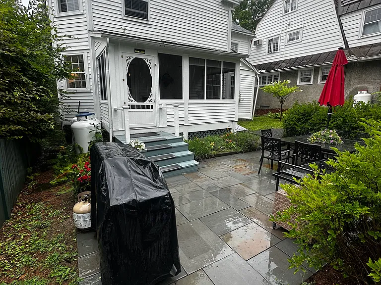 Stone patio and BBQ area