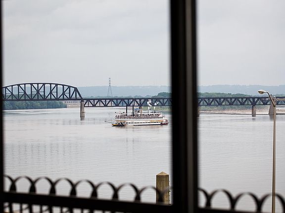Each has a balcony overlooking the river.