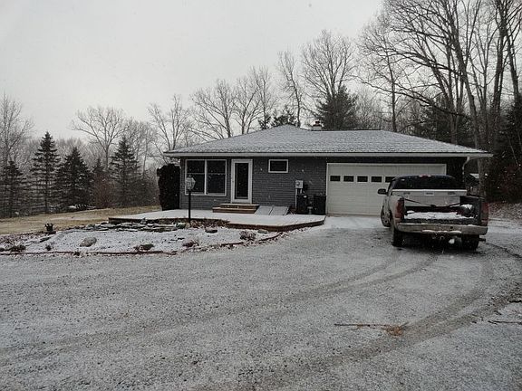 Side View (front door and 2 car attached garage)