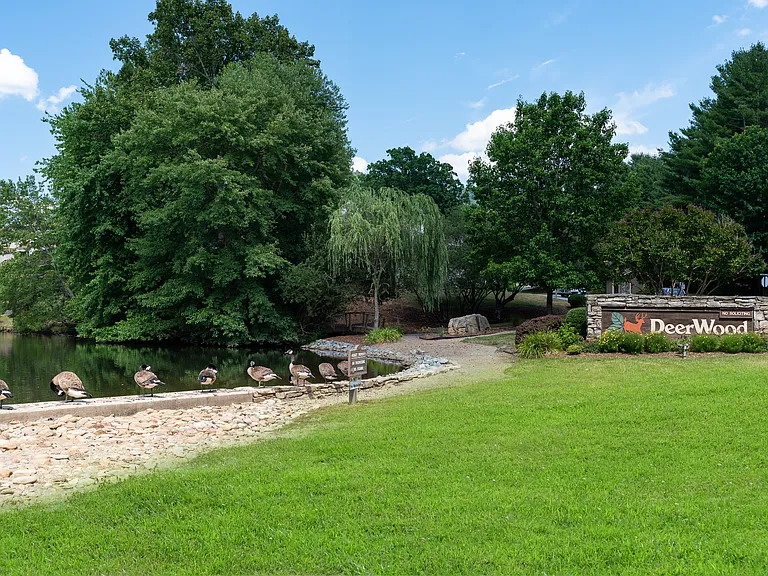 Entrance to the community with pond and walking path