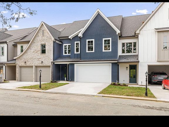 Front facade with double garage and private driveway parking