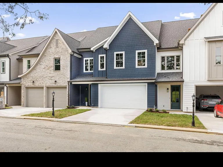 Front facade with double garage and private driveway parking