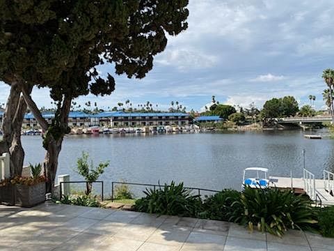 Sweeping lake view from dining, kitchen and living rooms.