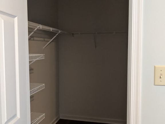 First floor master bedroom walk in closet.
