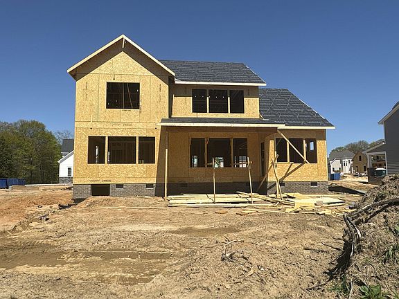 Back of Home with Covered Porch