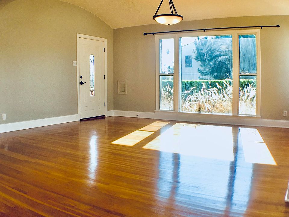 Another view of the Living Room out to ficus-hedged yard.