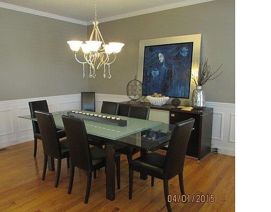 Formal dining room with wai...