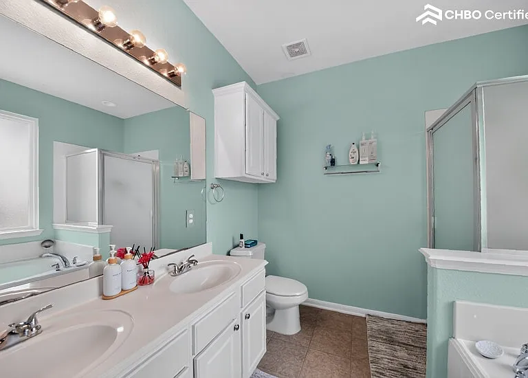 Primary bath includes separate shower and jetted bathtub