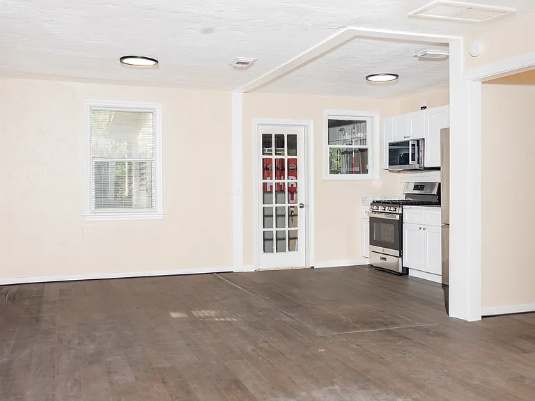 Kitchen space with laundry room door