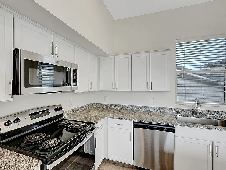 Experience culinary delight with this sleek and efficient kitchen design.