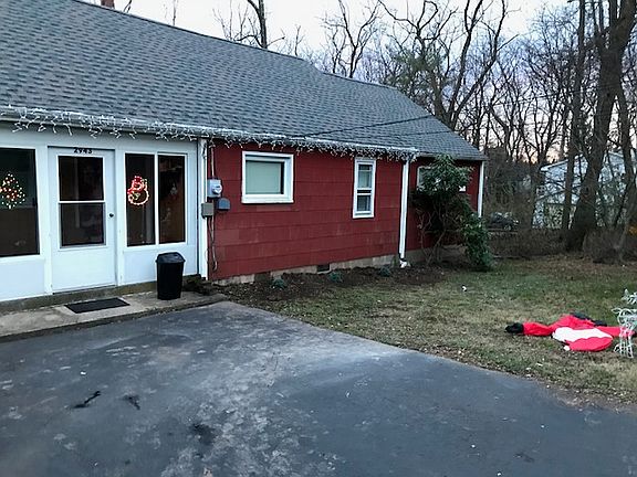 Winter time, some Christmas lights, Salt on driveway. New roof.