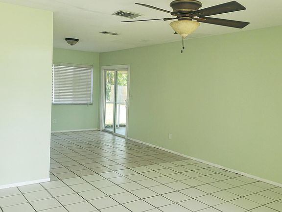 view from living area to dining area and sliders .