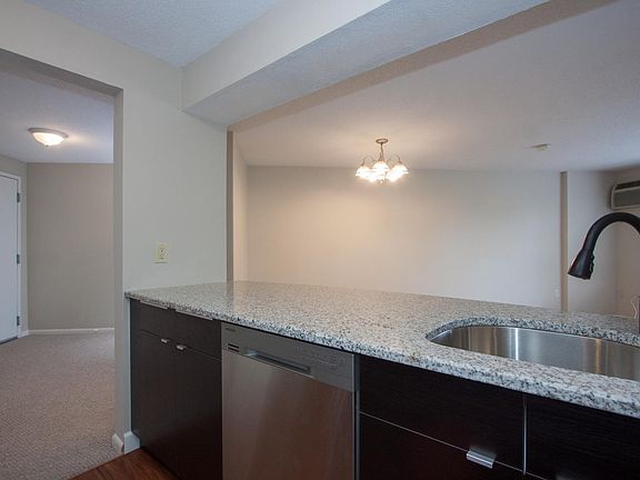 Kitchen includes dishwasher, granite breakfast bar