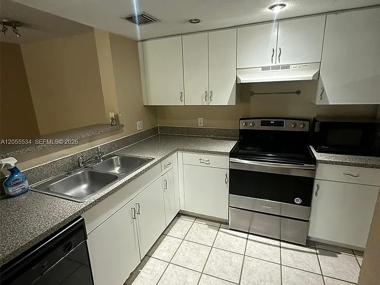 5035 Wiles Rd #203 — Photo 13