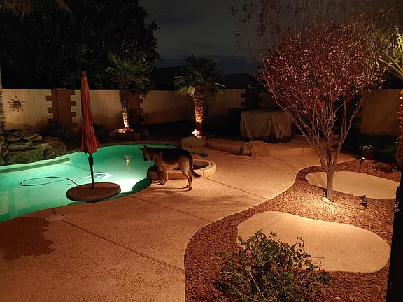 Backyard built for entertainment. Landscaped and lights on timer