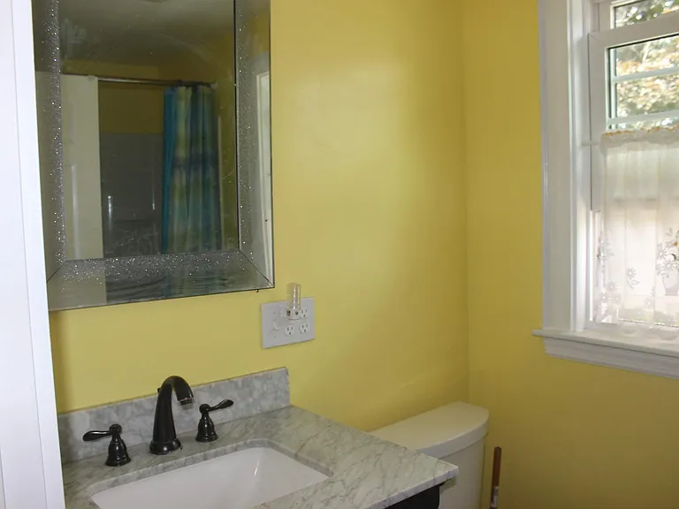 Guest Bathroom - Sink and toilet( with full size window)