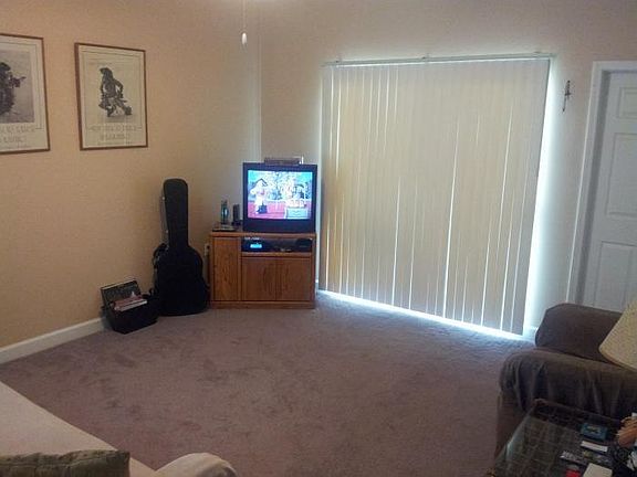 Living room with sliding glass door to backyard