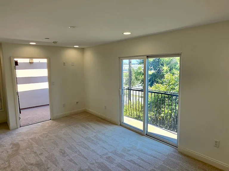 Master bedroom with balcony and outdoor patio