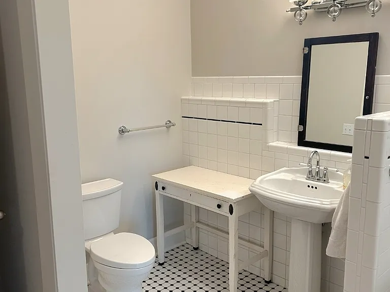 Charming bath nook blending historic character with everyday comfort.