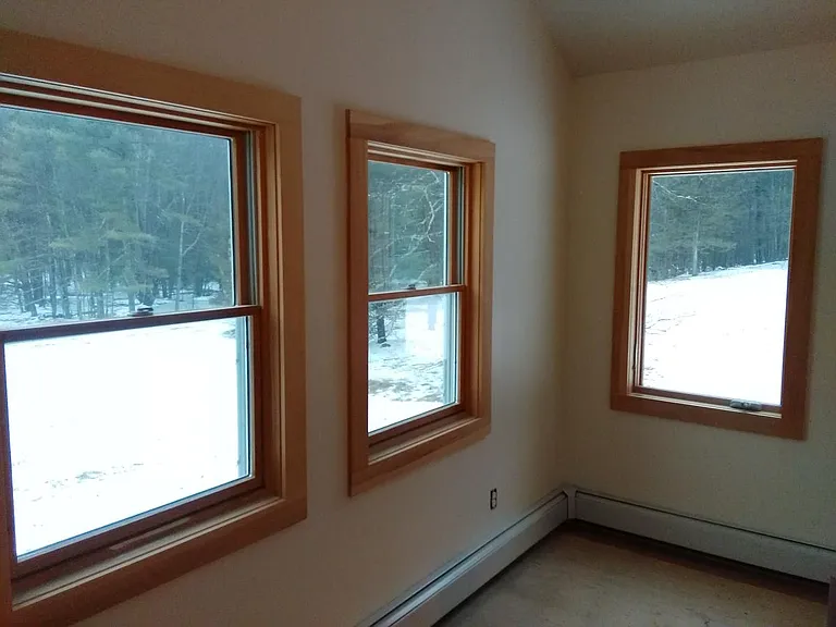 Well lit sizable Master bedroom with meadow lawn and woods View.