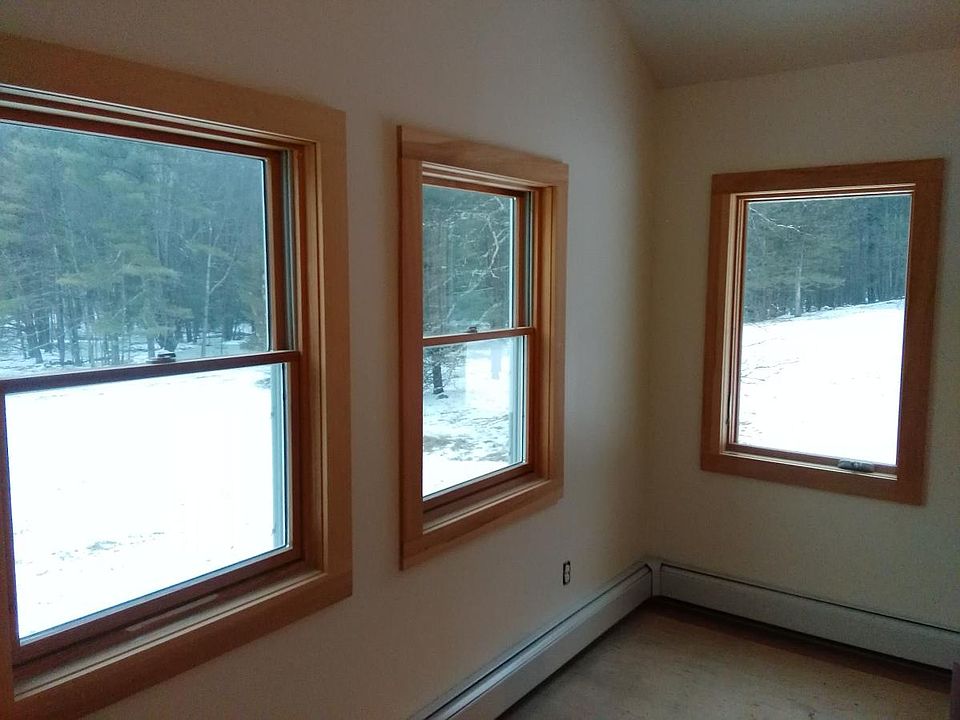 Well lit sizable Master bedroom with meadow lawn and woods View.