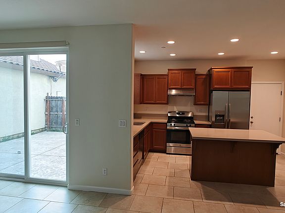 Kitchen, patio door to side yard