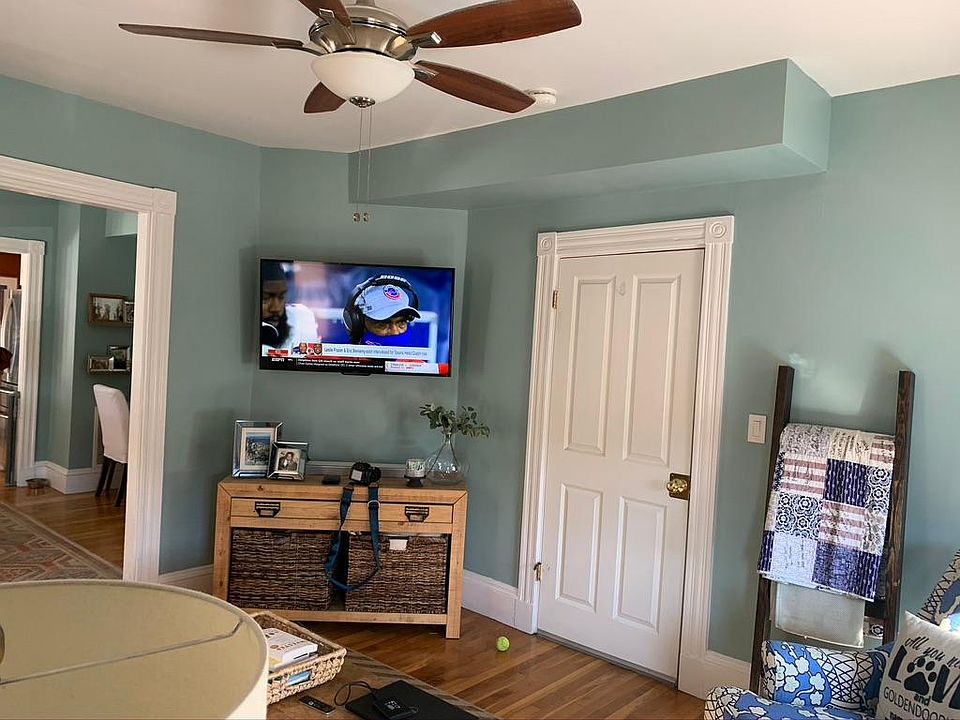 Living room with door to front entrance (apartment on second floor)