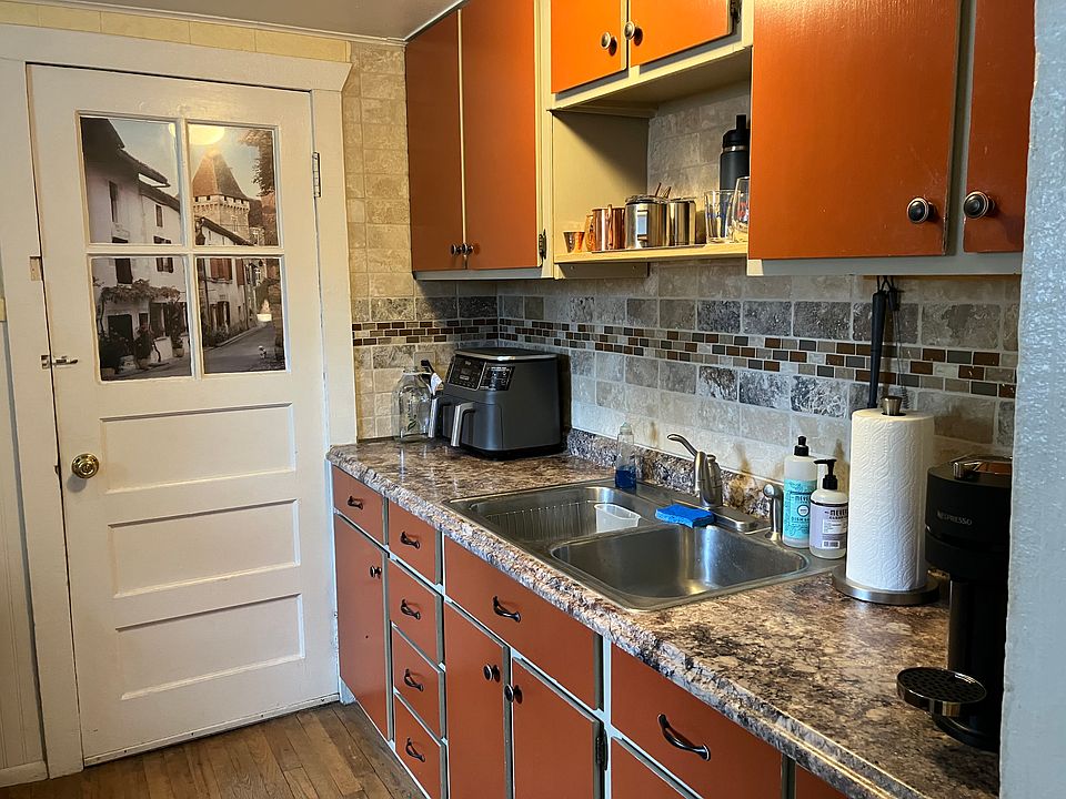 Door to shared laundry room and back stairway entrance